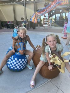 two sisters on rocking animals