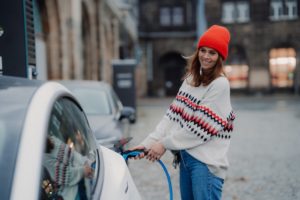 Woman putting gas on car