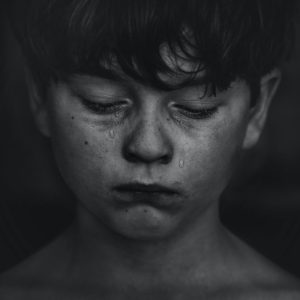 boy crying black and white photo