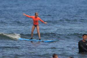 woman surfing in Hawaii